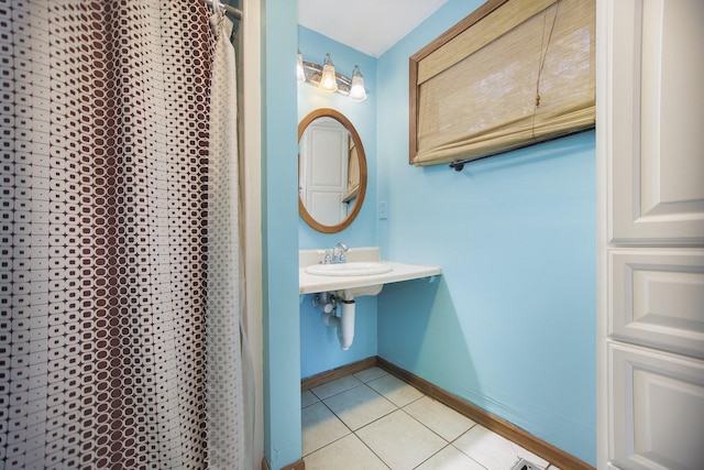 bathroom with tile patterned floors and sink