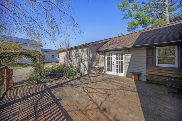 view of patio / terrace featuring french doors and a wooden deck