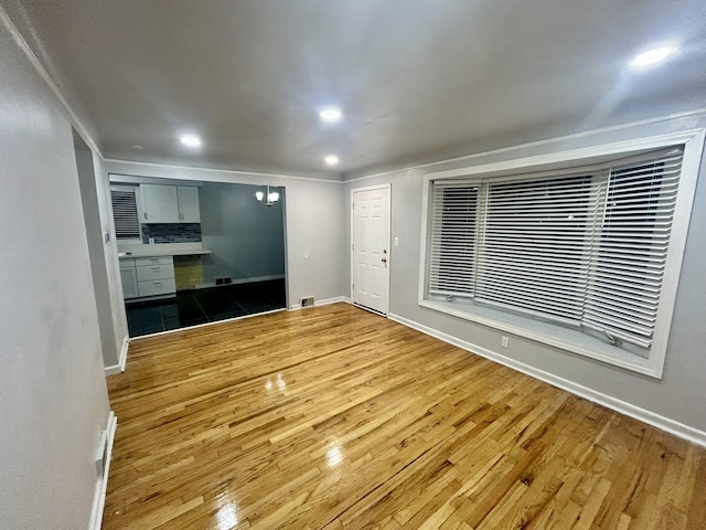 unfurnished living room featuring wood-type flooring