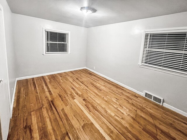 empty room featuring hardwood / wood-style floors