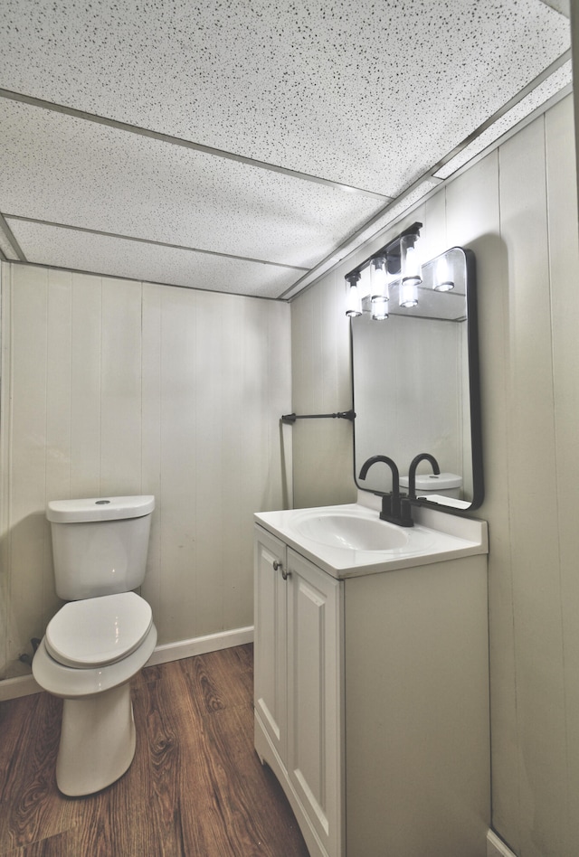 bathroom featuring hardwood / wood-style floors, vanity, and toilet