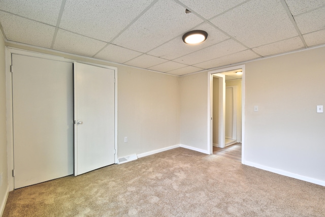 unfurnished room with light colored carpet