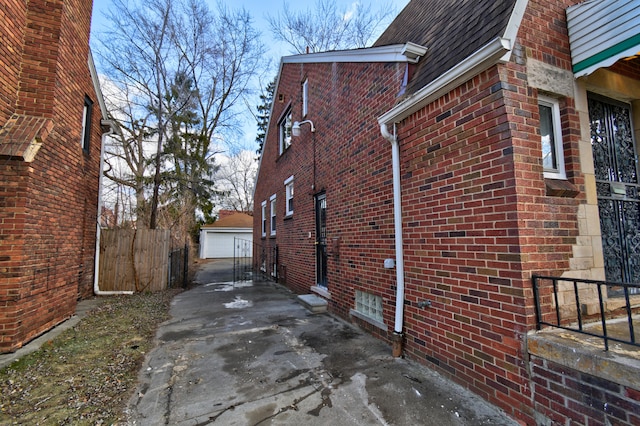 view of side of property with an outbuilding and a garage