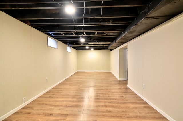 basement featuring light hardwood / wood-style flooring