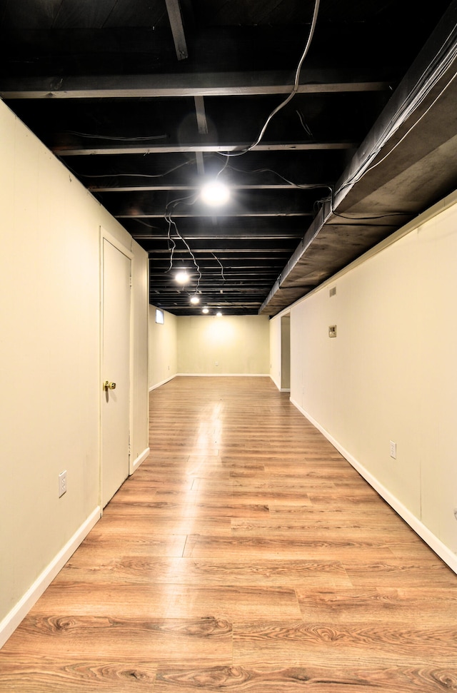 basement with light wood-type flooring