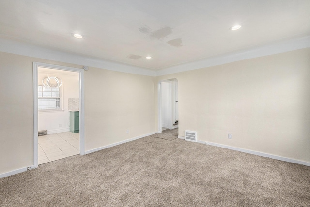 unfurnished room with light colored carpet