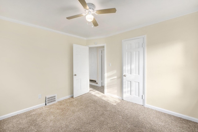 unfurnished room with light carpet, ceiling fan, and ornamental molding