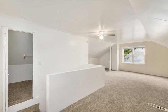 bonus room with carpet, ceiling fan, and lofted ceiling