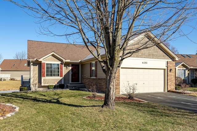 view of front of house featuring a garage and a front yard