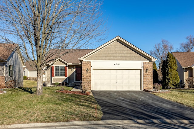 single story home with a garage and a front lawn