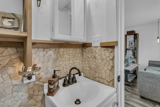 bathroom with sink and hardwood / wood-style floors