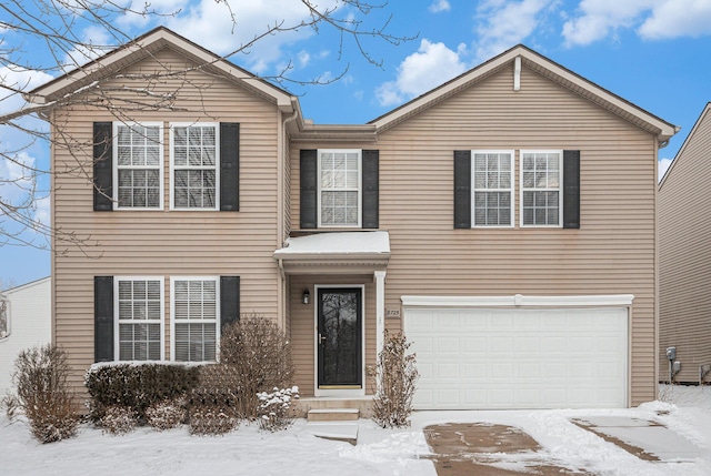 view of front of property with a garage