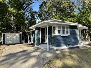 bungalow-style house with an outbuilding and a garage