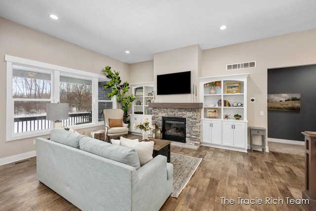 living room featuring a fireplace and light hardwood / wood-style floors