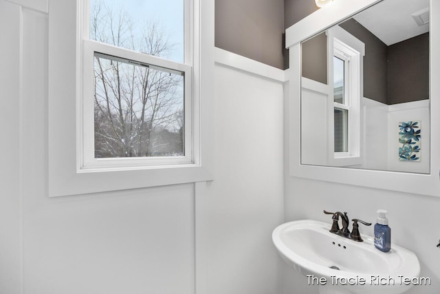 bathroom featuring plenty of natural light and sink