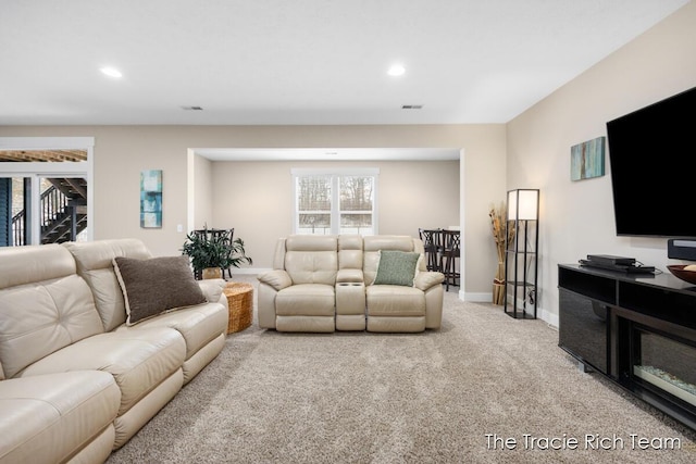 living room featuring light carpet