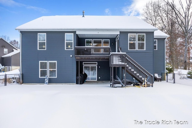 view of snow covered house