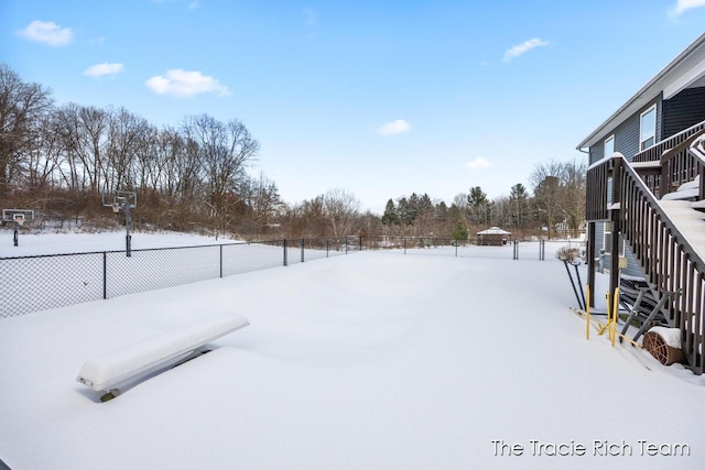 view of yard layered in snow