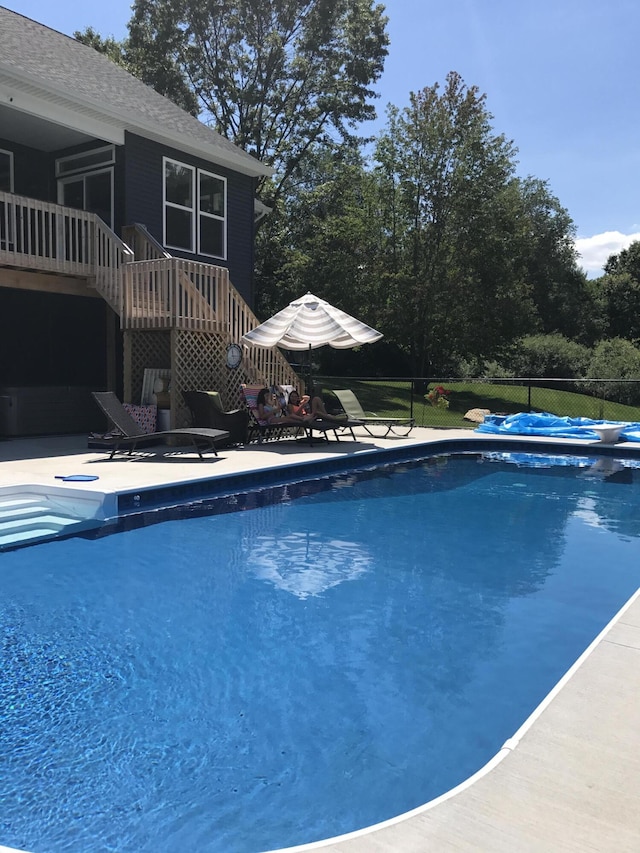 view of swimming pool featuring a patio area