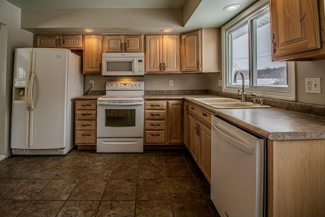 kitchen featuring sink and white appliances