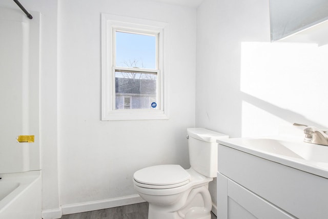 full bathroom with wood-type flooring, vanity, toilet, and shower / bathtub combination