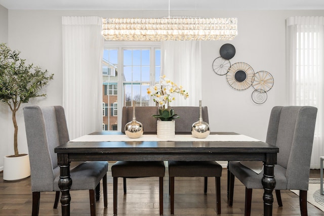 dining space with hardwood / wood-style floors