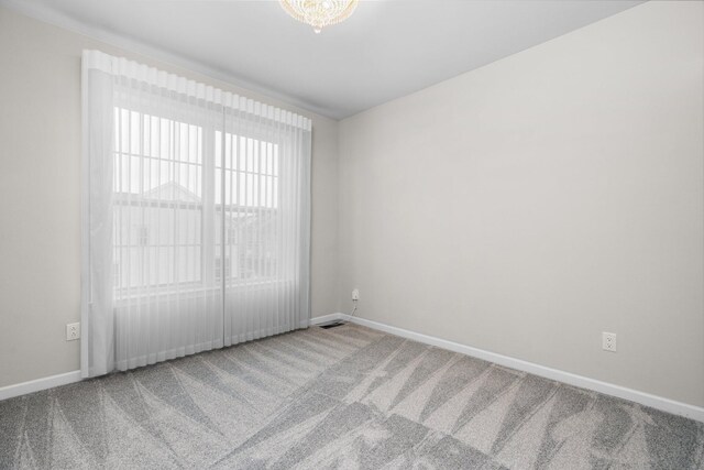 unfurnished room with carpet floors