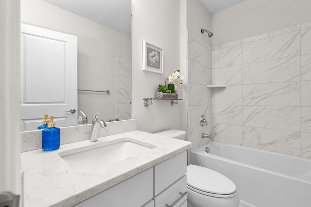 full bathroom featuring vanity, toilet, and tiled shower / bath