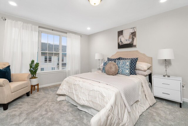 bedroom with light colored carpet