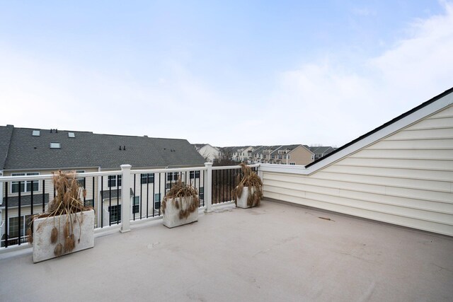 view of patio featuring a balcony