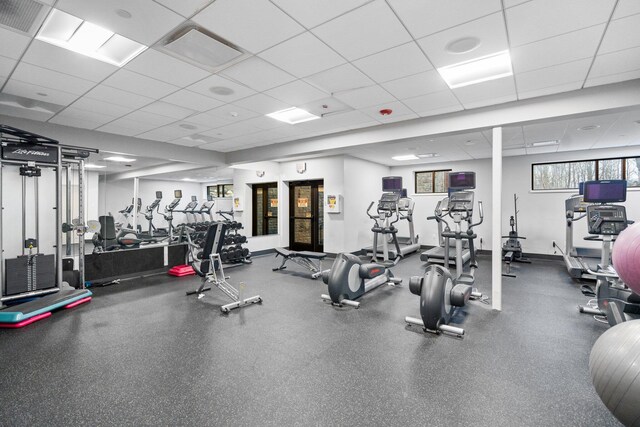 workout area featuring a drop ceiling