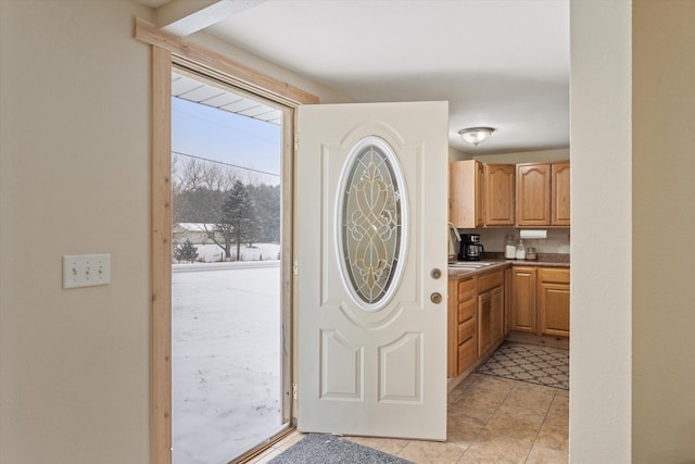 kitchen with sink and light brown cabinets