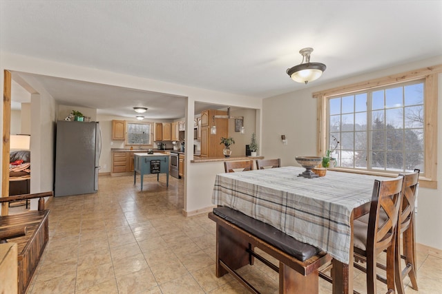 dining space featuring light tile patterned floors