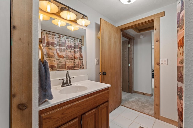 bathroom with tile patterned flooring and vanity