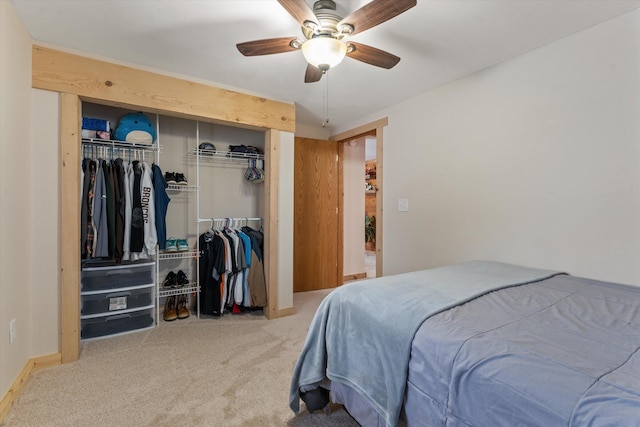 bedroom featuring ceiling fan, two closets, and carpet flooring