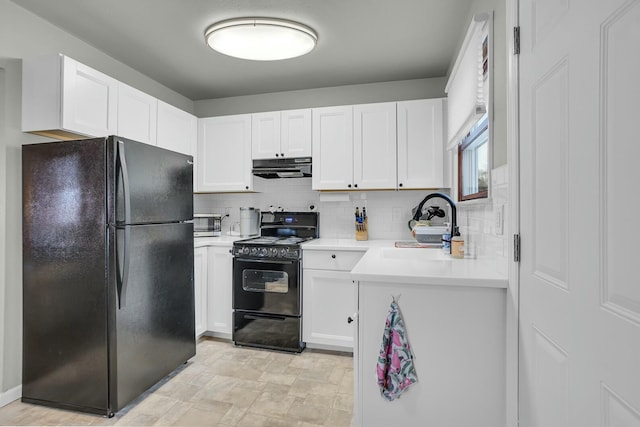 kitchen featuring backsplash, sink, white cabinets, and black appliances