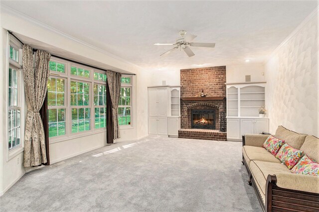 119 Kingsbury Ct, Battle Creek, MI 49015 - living room with ceiling fan, a fireplace, carpet floors, and ornamental molding