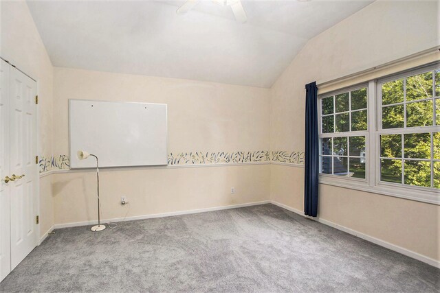 119 Kingsbury Ct, Battle Creek, MI 49015 - spare room featuring ceiling fan, carpet, and lofted ceiling