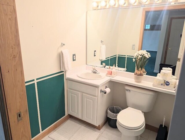 119 Kingsbury Ct, Battle Creek, MI 49015 - bathroom featuring tile patterned flooring, vanity, and toilet