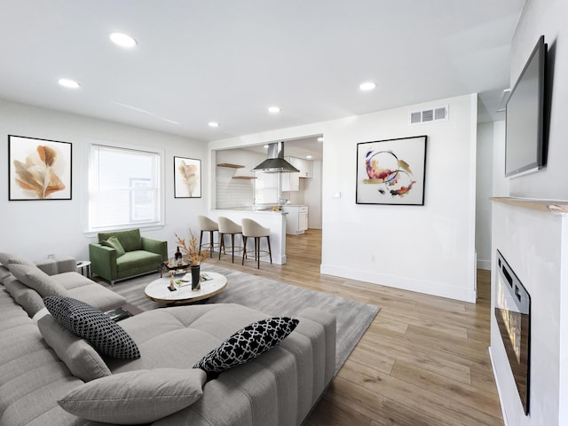 living room with light hardwood / wood-style floors