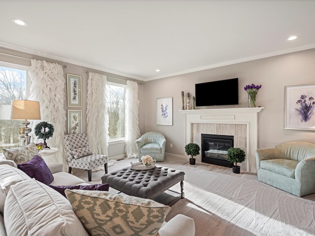 living room featuring a fireplace, ornamental molding, and a healthy amount of sunlight