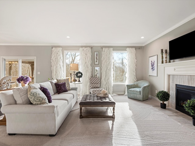 living room with ornamental molding and a fireplace