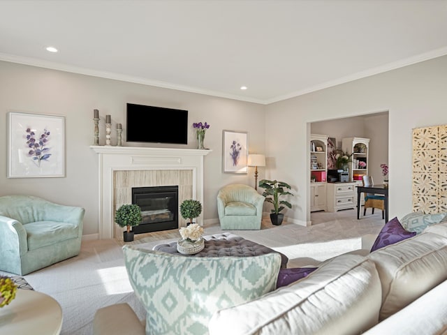 carpeted living room with a tile fireplace and ornamental molding