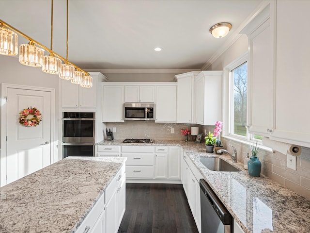 kitchen featuring white cabinets, sink, and appliances with stainless steel finishes