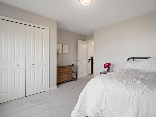 carpeted bedroom with a closet