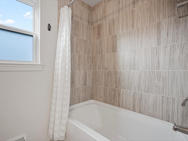 bathroom featuring shower / tub combo