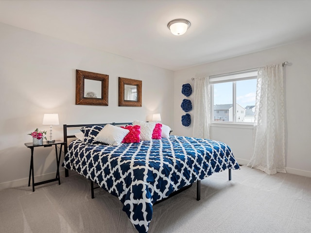 bedroom featuring light colored carpet