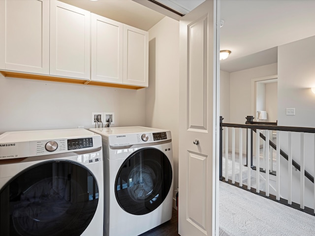 washroom featuring dark carpet, cabinets, and independent washer and dryer