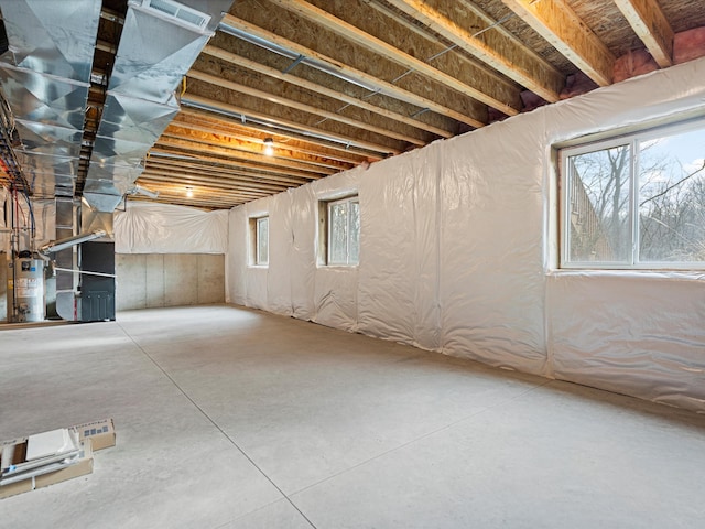 basement with heating unit and water heater