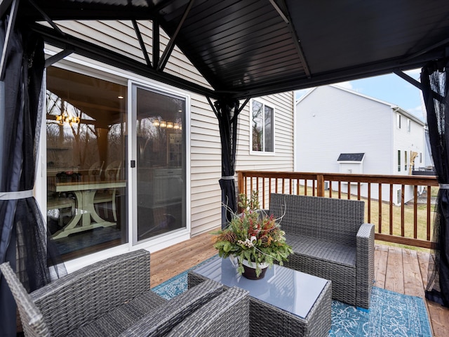 wooden balcony with outdoor lounge area and a deck